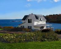 McFarland Cottage -Harborside.  Queen bedroom and twin bedroom with baths, porch.  Living room with fireplace, kitchen.